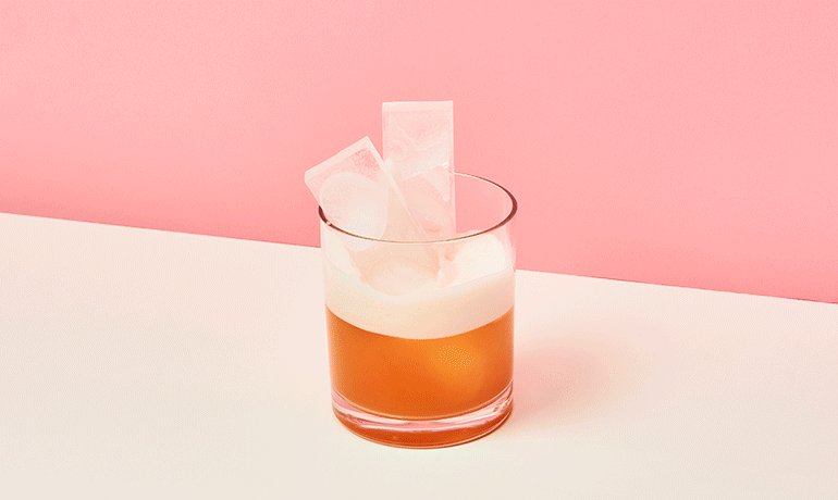 A gif of red wine being floated at the top of a New York Sour.