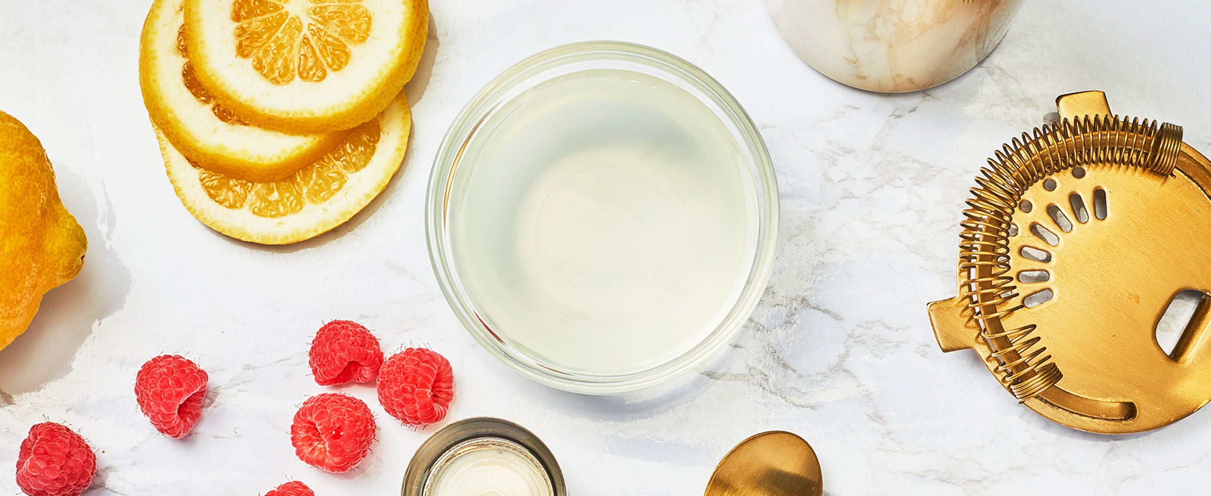 A flat lay image of the Raspberry Lemonade Cocktail ingredients.