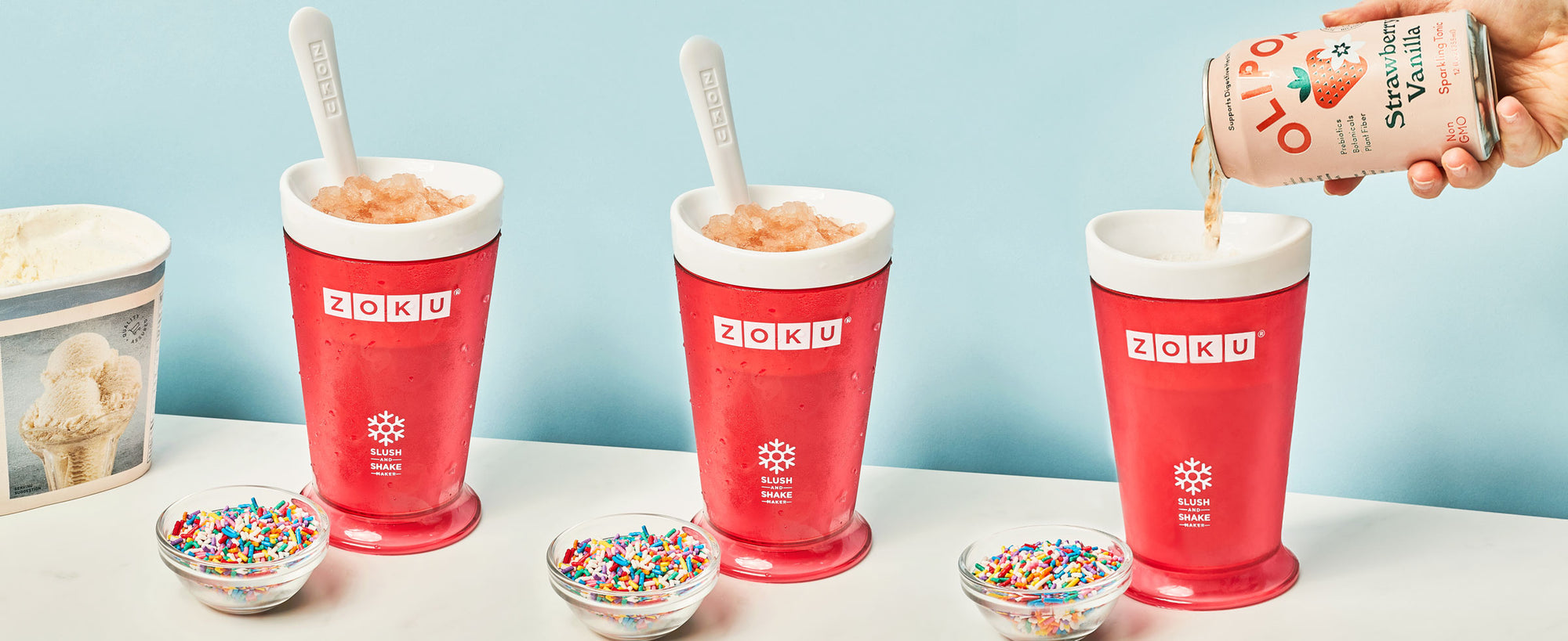 An image showing how to make a soda slushy featuring three ZOKU Slush & Shake Makers as a can of Olipop is being added to the rightmost slush maker.