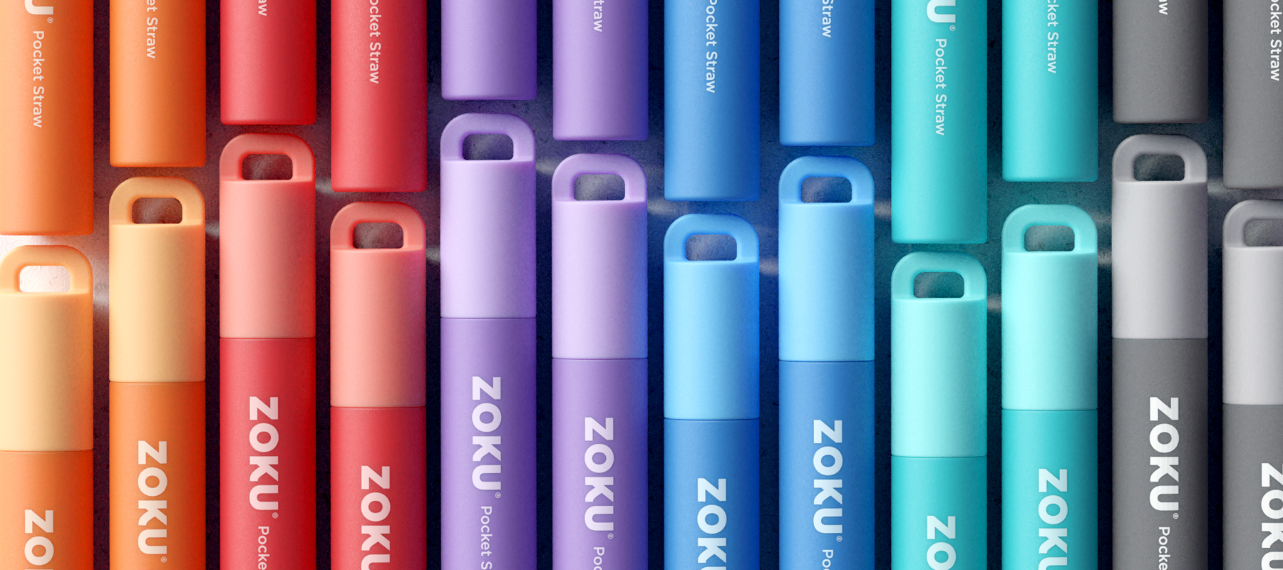  A close-up shot of the ZOKU Two Tone Pocket Straws showcases their vibrant colors: Orange, Red, Purple, Blue, Teal, and Charcoal.